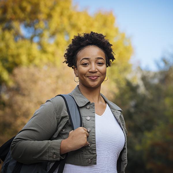 portrait of a student with backpack on shoulder